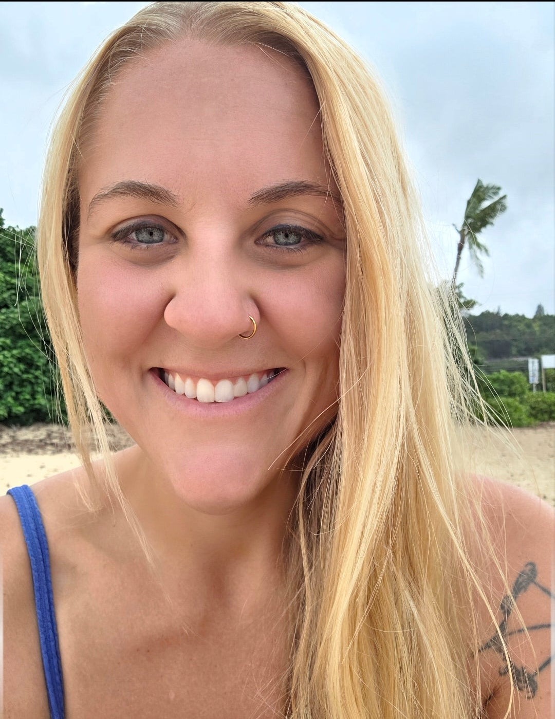 Owner of Lipe Luffa Co., smiling on the beach on O'ahu
